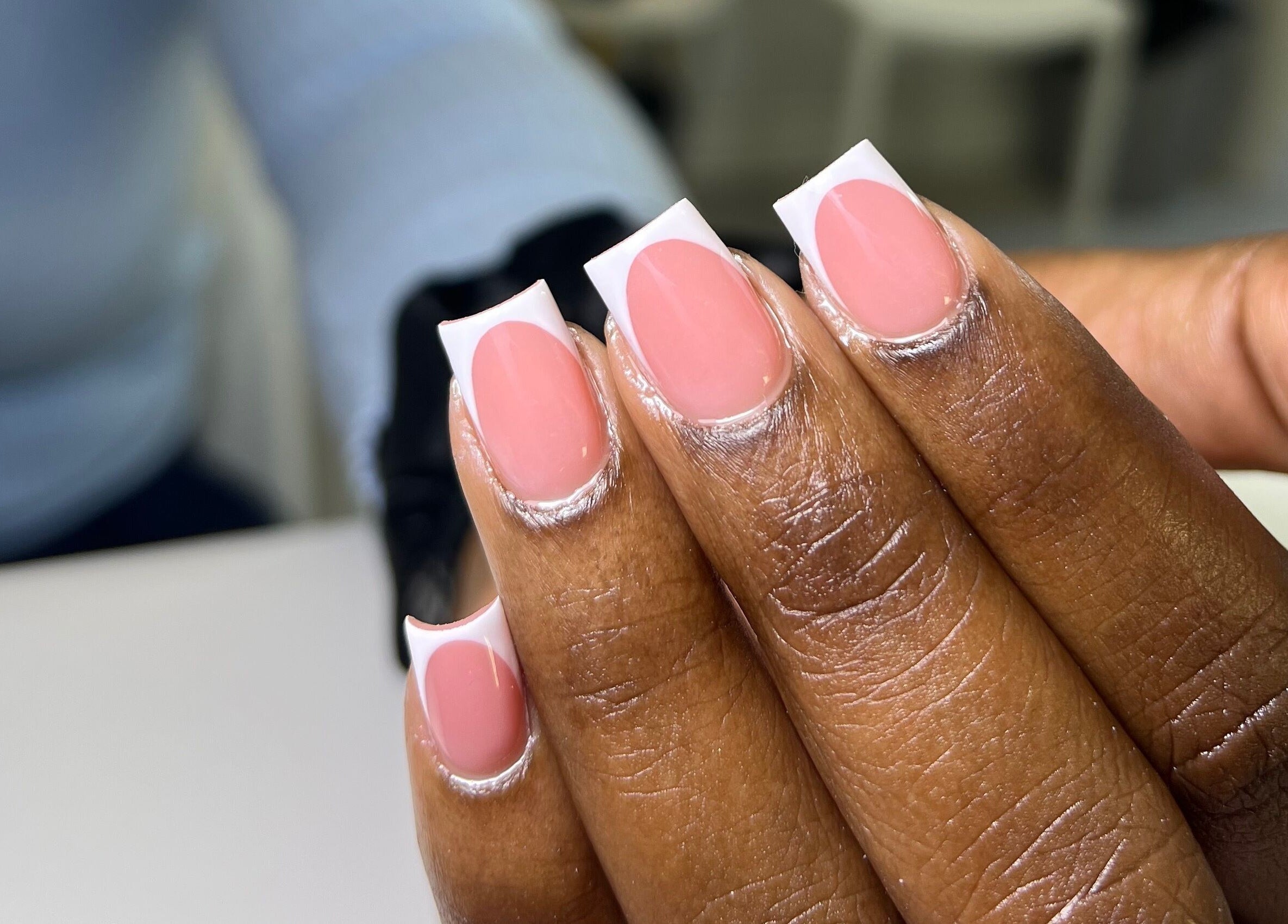 Elegant French manicure at XxClusive Nails, Bridgetown, Saint Michael, BB. Perfect for a polished look.