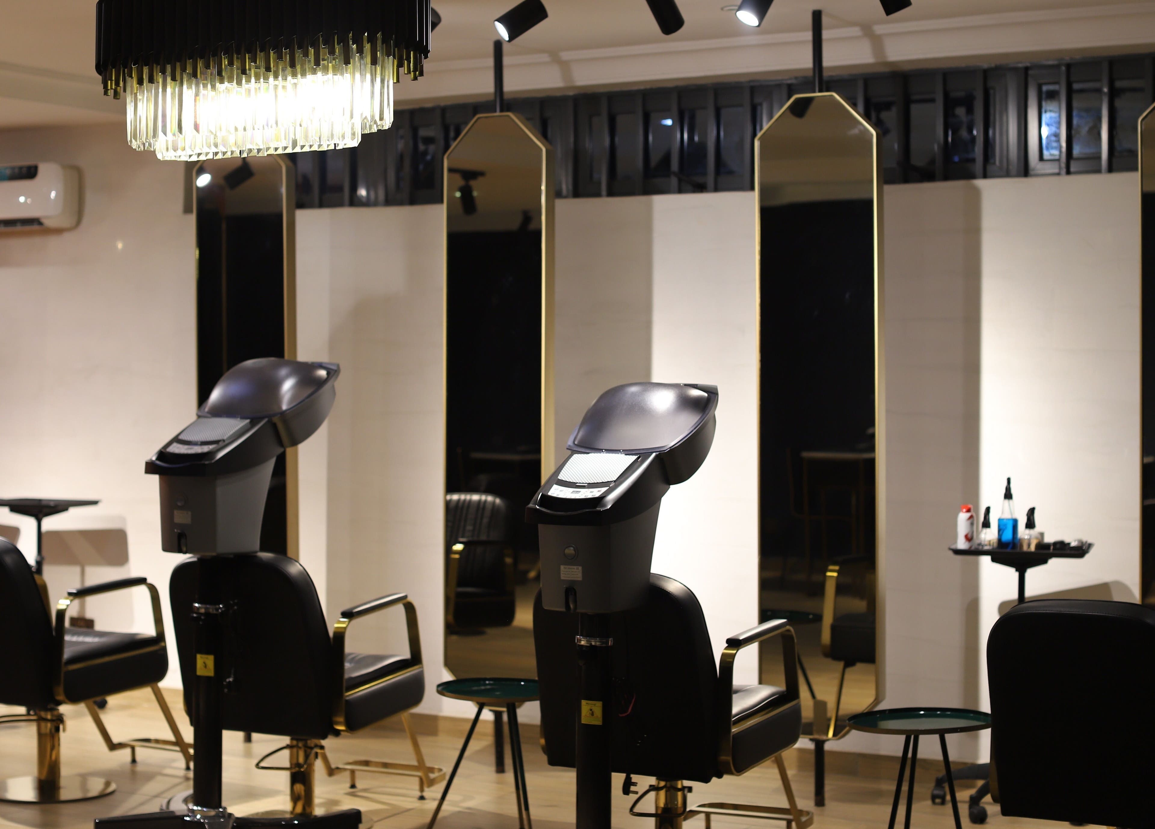 Chic hair styling stations at VstylesHair & Beauty Studio in Ikeja, Lagos, NG with modern decor and lighting.