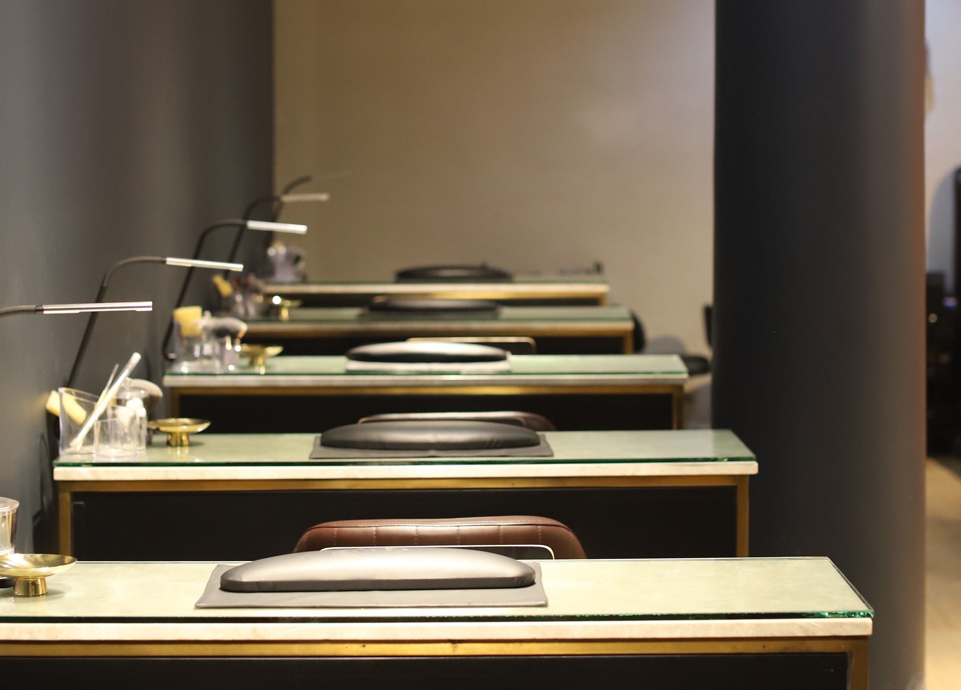 Chic manicure stations at VstylesHair & Beauty Studio, Ikeja, Lagos, NG, showcasing a sleek, modern setup.