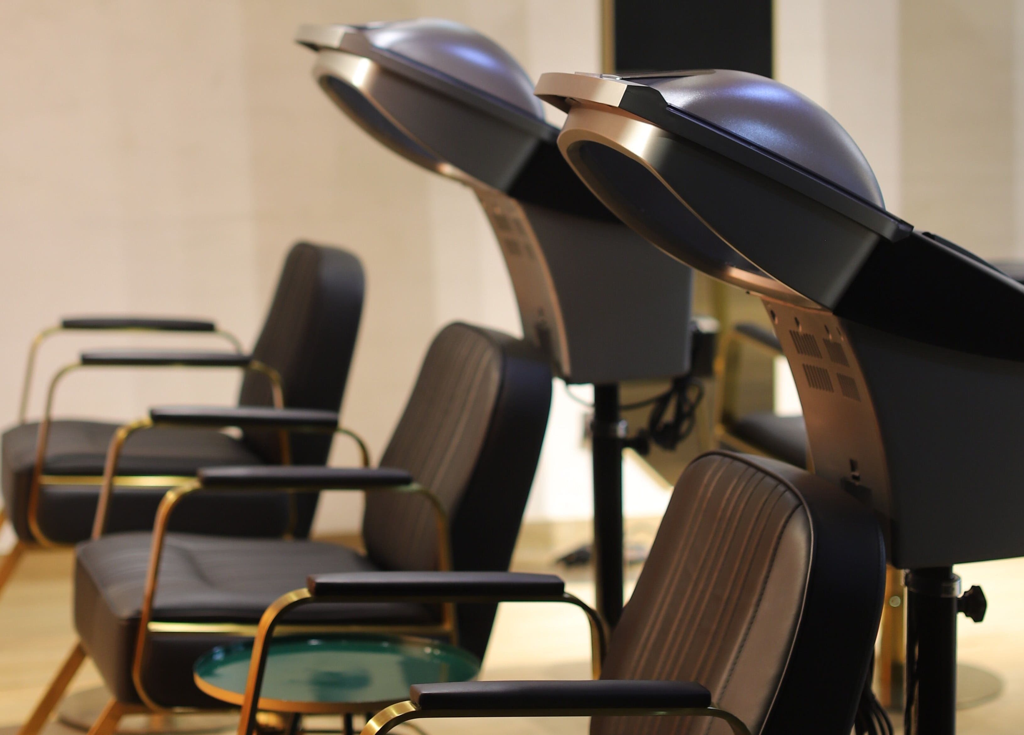 Modern salon chairs at VstylesHair & Beauty Studio, Ikeja, Lagos, NG, showcasing luxury and comfort.