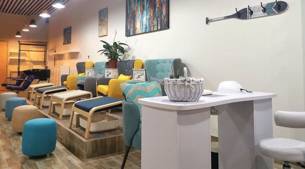 Luxurious pedicure area at Zoli Fam Ladies Salon, Dubai, Dubai, AE with colorful chairs and modern decor.