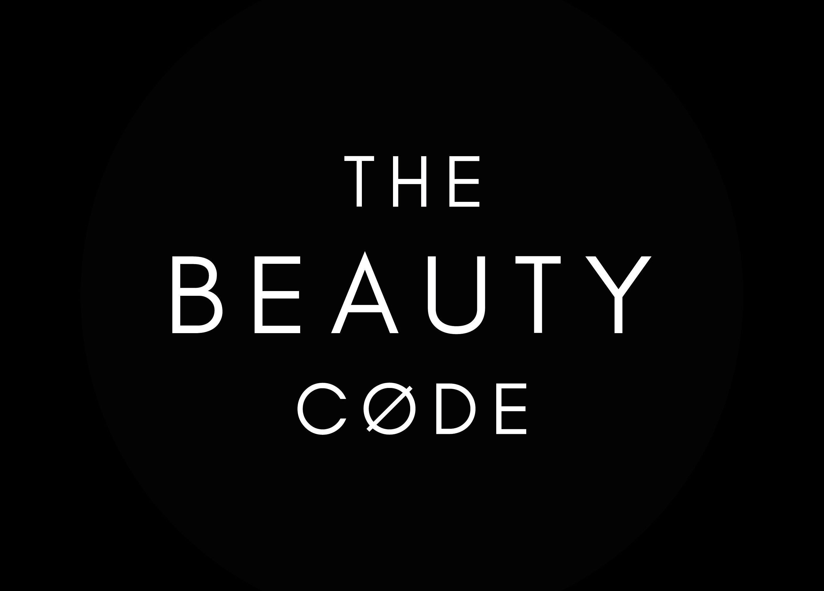 Logo for The Beauty Code, a beauty and wellness venue in St Austell, England, GB. Black background with white text.