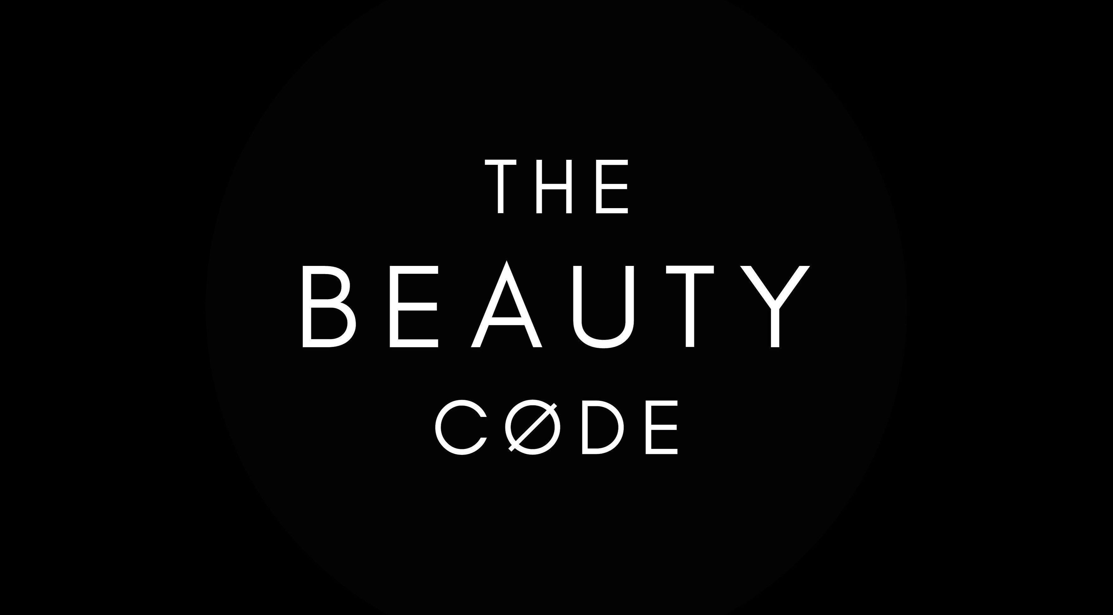 Logo for The Beauty Code, a beauty and wellness venue in St Austell, England, GB. Black background with white text.