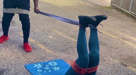 Open Beauty Divine Spa outdoor exercise with bands in Kingston, St. Andrew Parish, JM, promoting wellness.