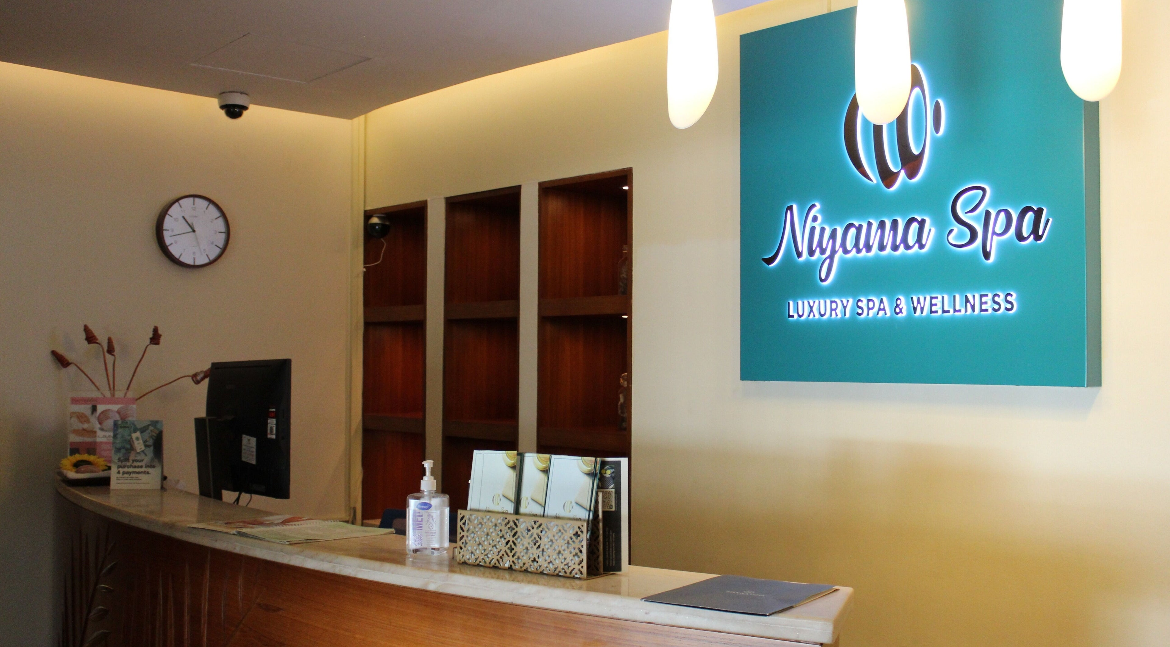 Reception desk at Niyama Spa, Sheraton Hotel Dubai Creek, Dubai, AE with elegant lighting and a welcoming vibe.