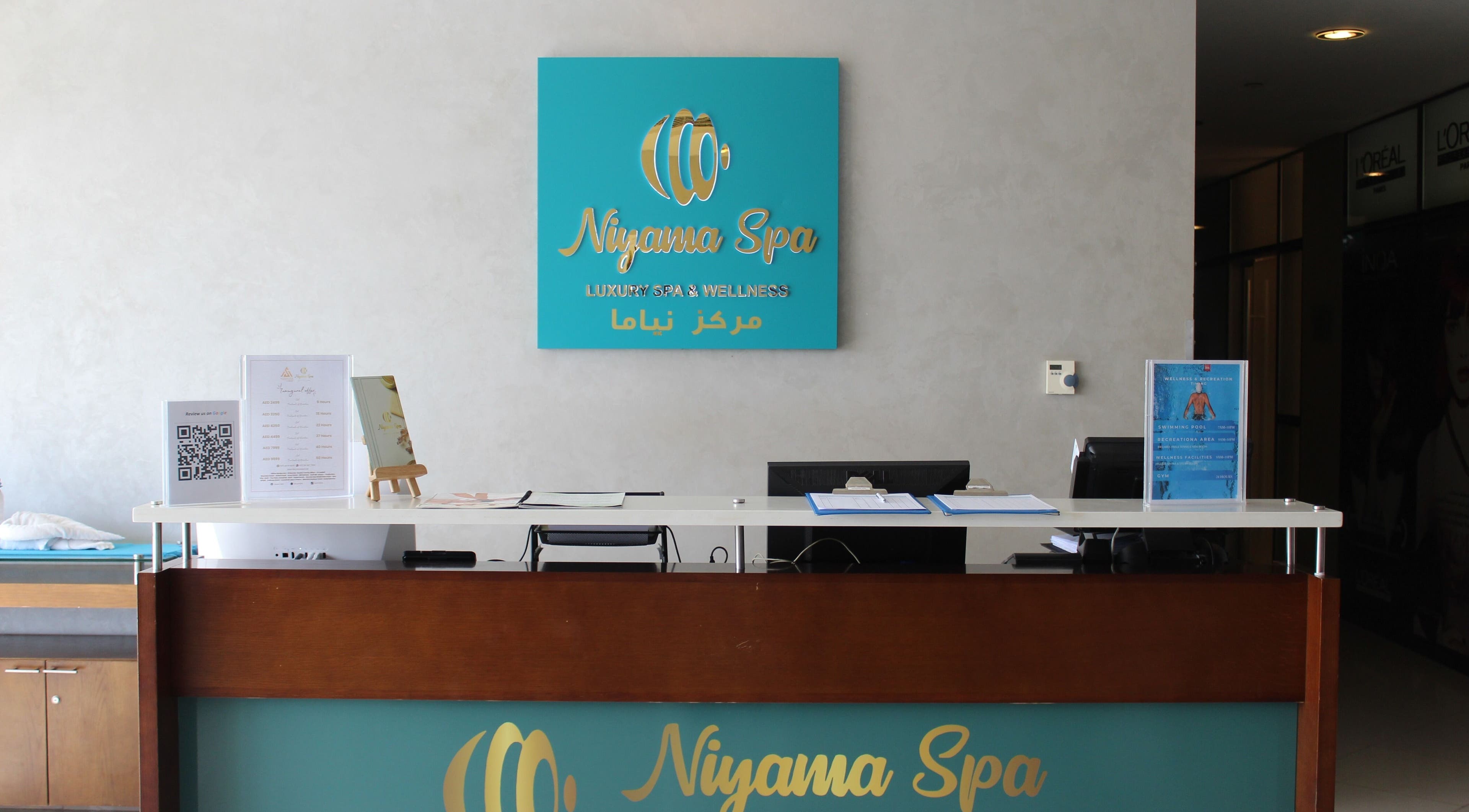 Reception desk at Niyama Spa - Novotel Abudhai Gate, featuring elegant decor in Abu Dhabi, AE.
