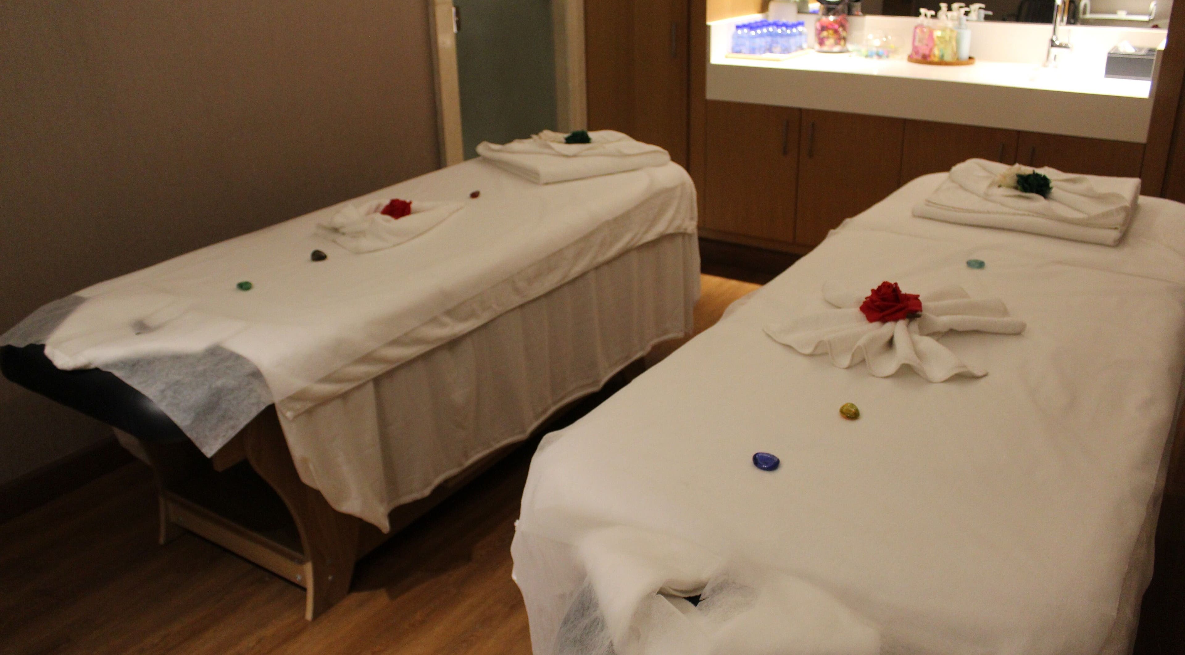Relaxing massage tables at Niyama Spa at Hilton Garden Inn Albarsha, Dubai, Dubai, AE, with serene decor.