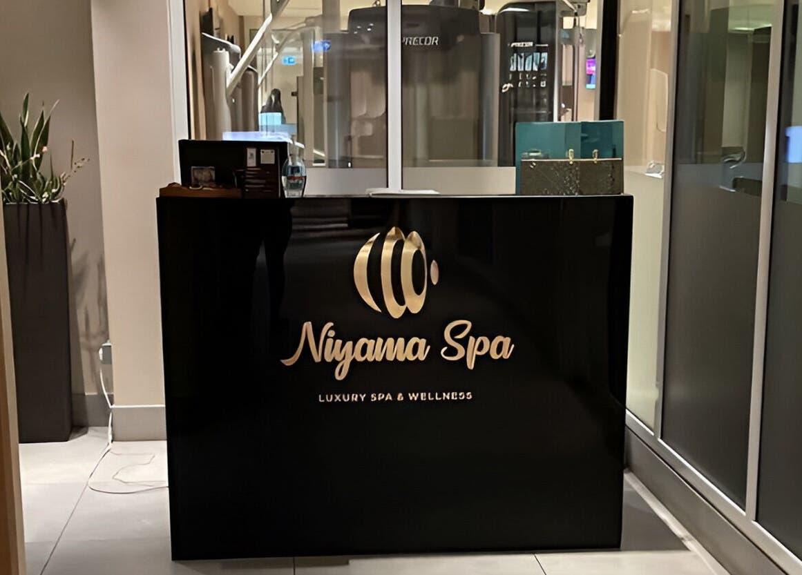 Reception desk at Niyama Spa at Hilton Garden Inn Albarsha, Dubai, Dubai, AE. Modern and inviting atmosphere.