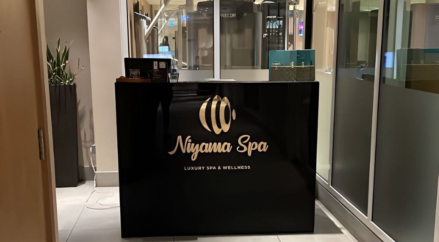 Reception desk at Niyama Spa at Hilton Garden Inn Albarsha, Dubai, Dubai, AE. Modern and inviting atmosphere.