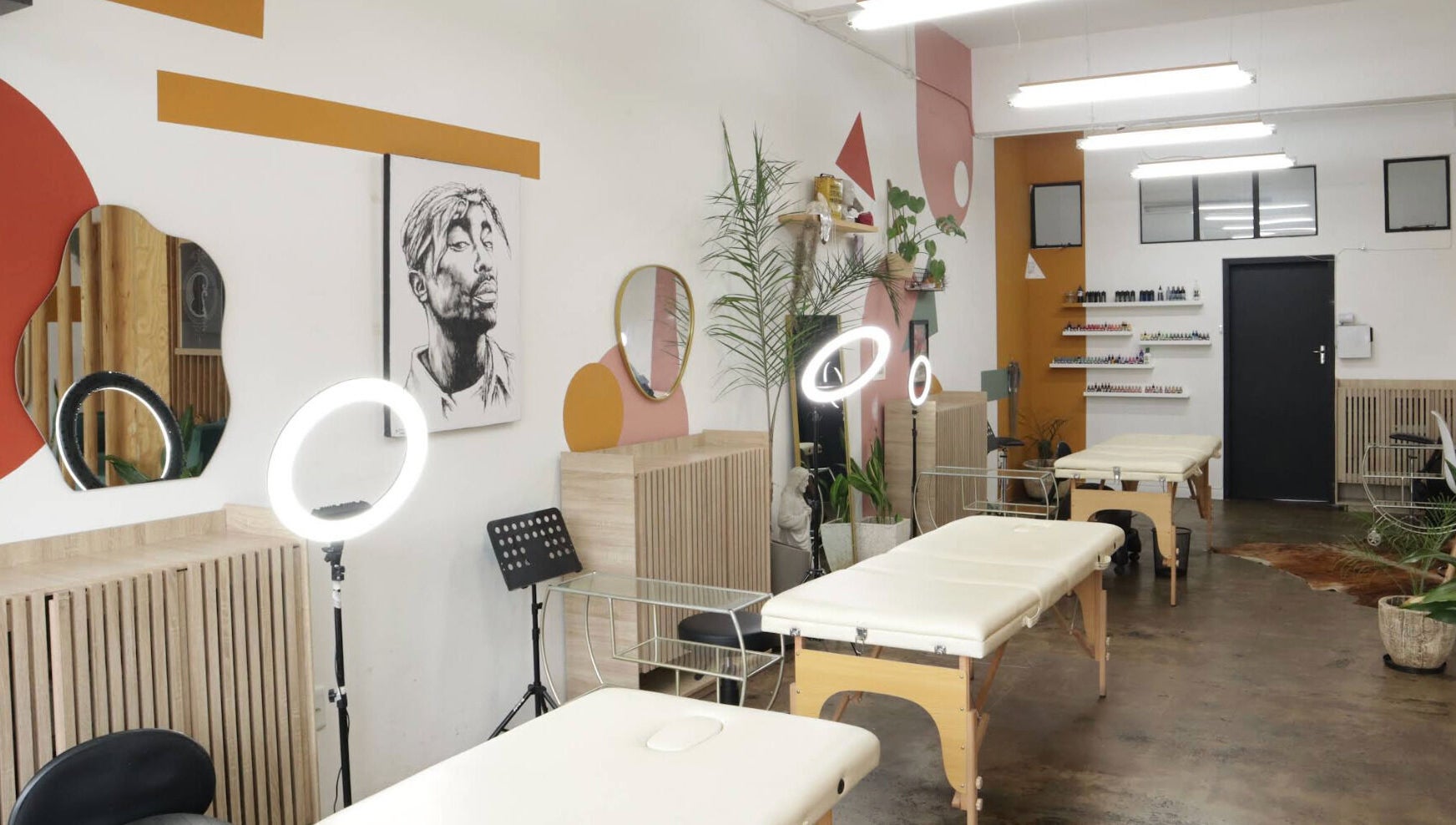 Modern treatment room at Olive and Co. Studios in Randburg, Gauteng, ZA with art and plants.