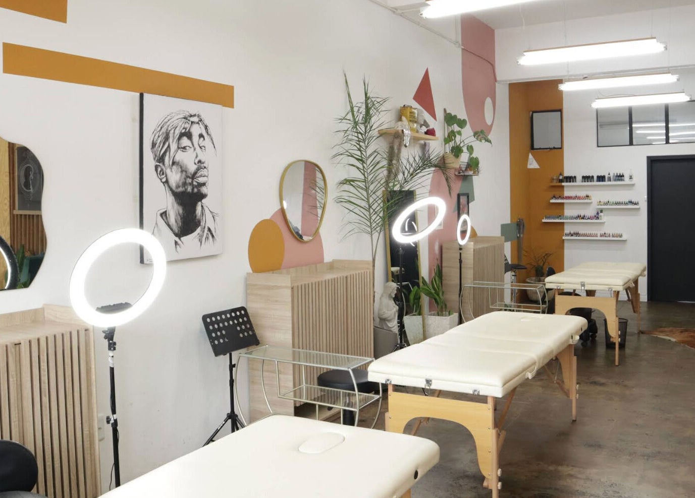 Modern treatment room at Olive and Co. Studios in Randburg, Gauteng, ZA with art and plants.