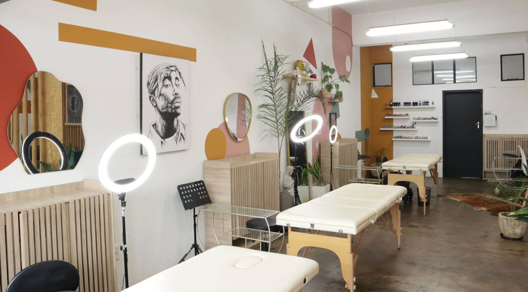 Modern treatment room at Olive and Co. Studios in Randburg, Gauteng, ZA with art and plants.