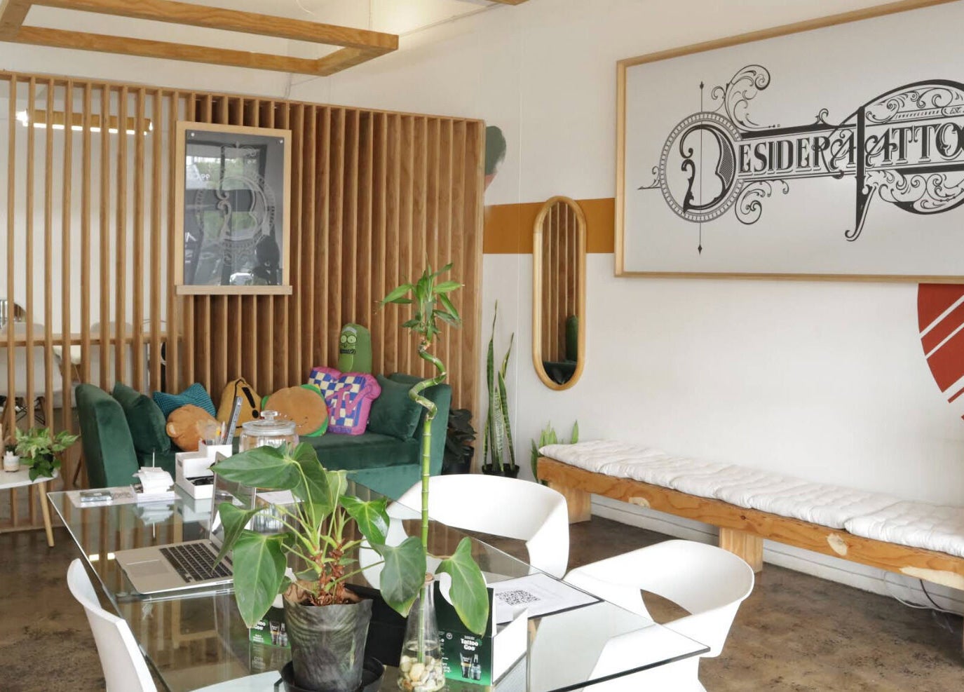 Chic seating area with plants in Olive and Co. Studios, Randburg, Gauteng, ZA, showcasing modern decor.