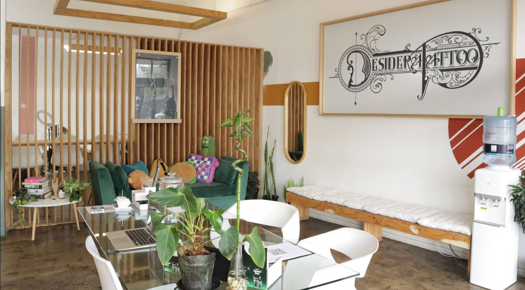 Chic seating area with plants in Olive and Co. Studios, Randburg, Gauteng, ZA, showcasing modern decor.