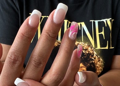Stylish French manicure with pink accents at Helen's Nails & Spa, Wildwood, Florida, US.