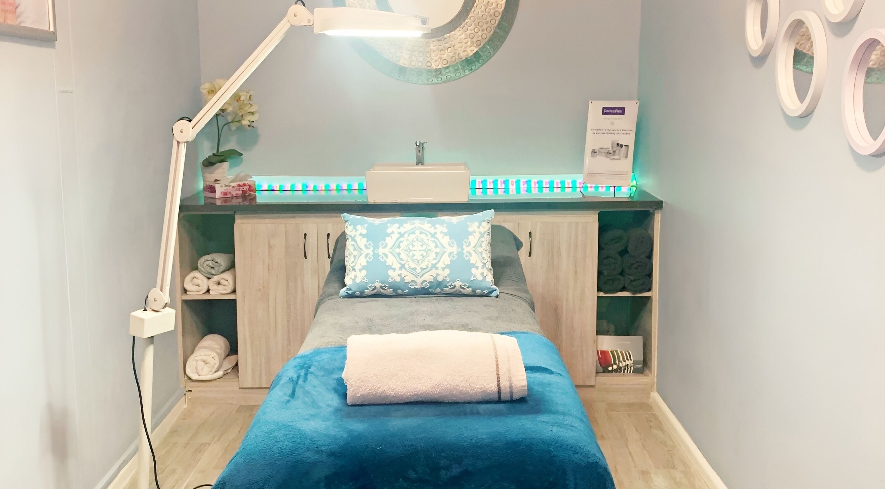 Cozy treatment room at Blissful Beauty, Cape Town, Western Cape, ZA, featuring a plush bed with towels.