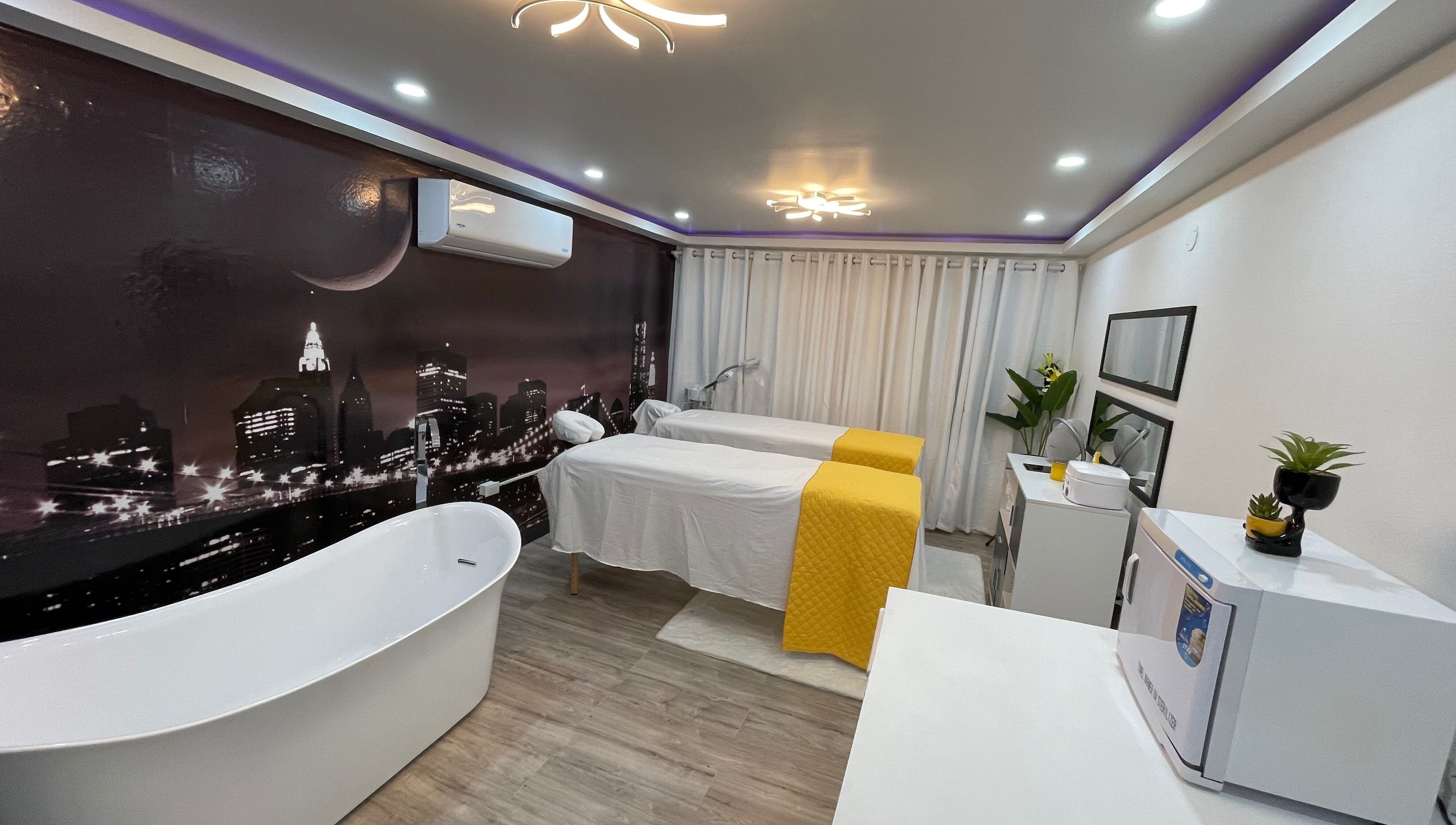 Elegant spa room at Beauty Statement Salon & Spa, Ocho Rios, JM featuring massage tables and a modern bathtub.