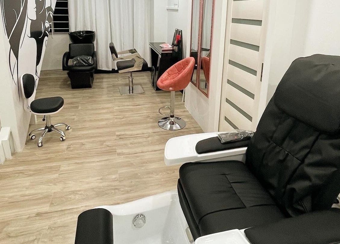 Modern salon interior at Beauty Statement Salon & Spa, Ocho Rios, JM, featuring plush seating and stylish decor.