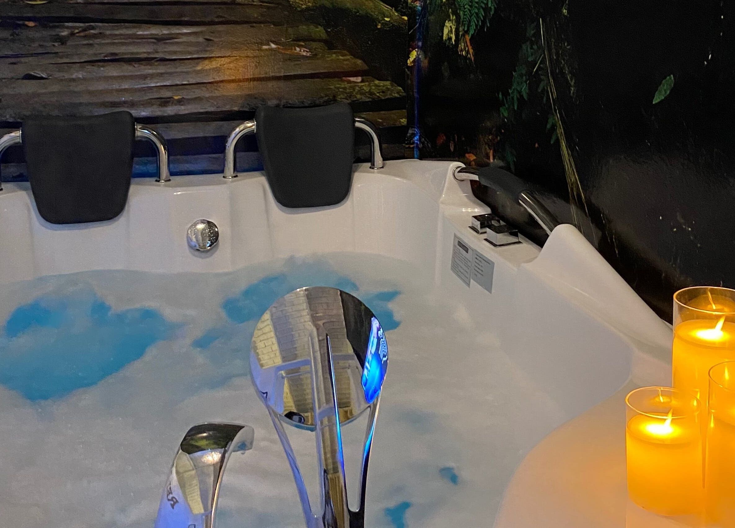 Relaxing spa tub with candles at Beauty Statement Salon & Spa, Ocho Rios, JM, perfect for relaxation.