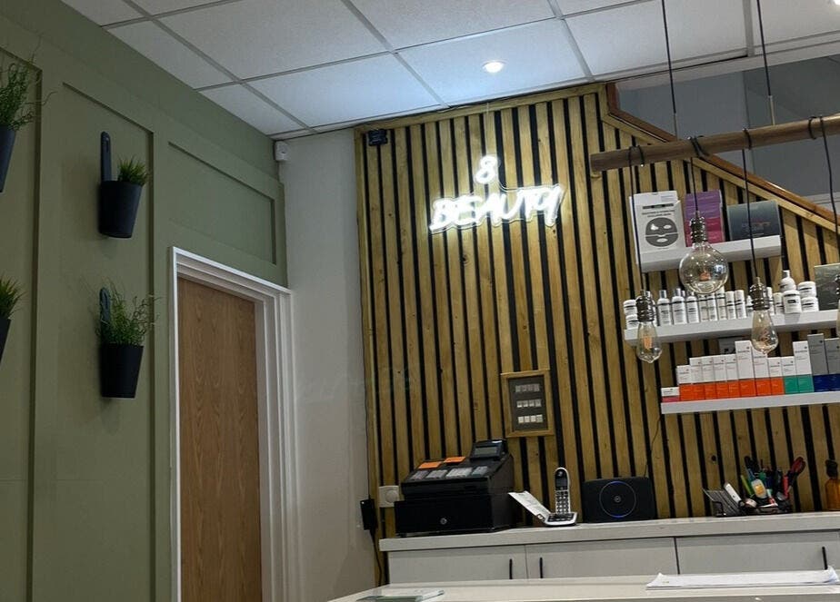 Modern reception at Nails by Erin in Londonderry, Northern Ireland, GB with stylish decor and shelves.