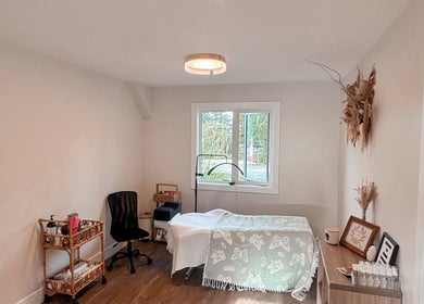 Relaxing treatment room at Studio 13 Esthetics in Chilliwack, British Columbia, CA, with natural decor and gentle lighting.