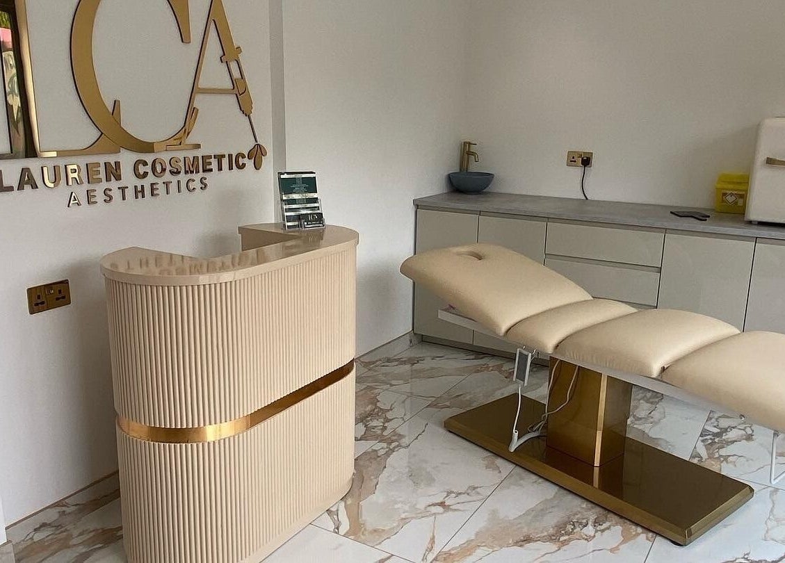 Elegant interior of Lauren Cosmetic Aesthetics in Wigan, England, featuring a plush treatment chair and stylish decor.
