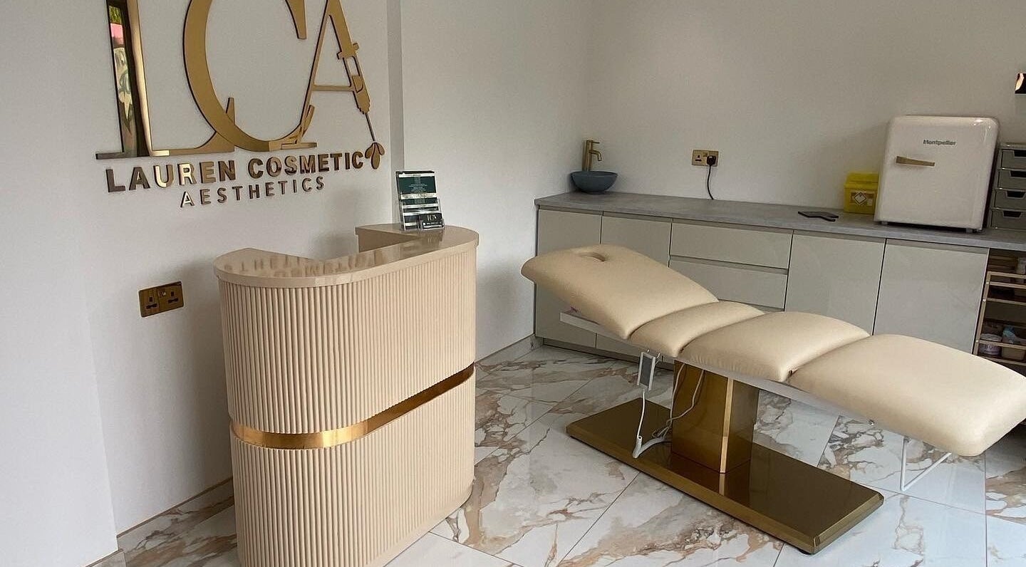 Elegant interior of Lauren Cosmetic Aesthetics in Wigan, England, featuring a plush treatment chair and stylish decor.