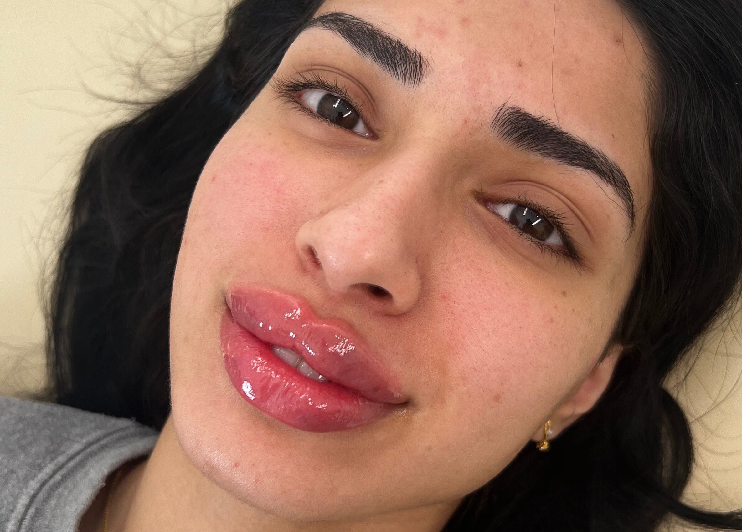 Woman with vibrant lips after treatment at Lauren Cosmetic Aesthetics, Wigan, England, GB.