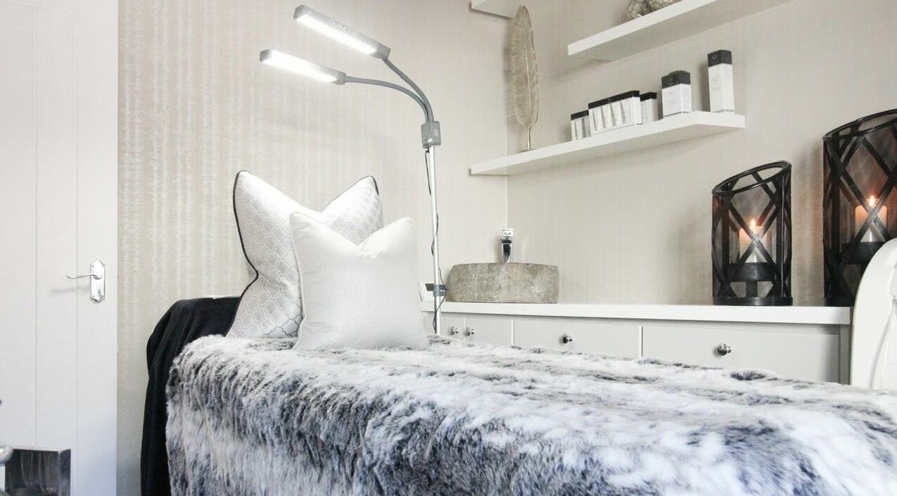 Luxurious treatment room at Chique, Penrith, England, GB with plush decor and soft lighting.