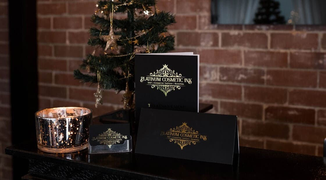 Festive setup at Platinum Cosmetic Ink - Perth with a candle and decor in Como, Western Australia, AU.