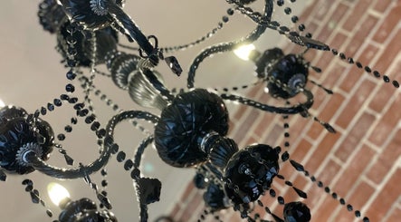 Black chandelier adds luxury to Platinum Cosmetic Ink - Broome's venue, Cable Beach, Western Australia, AU.