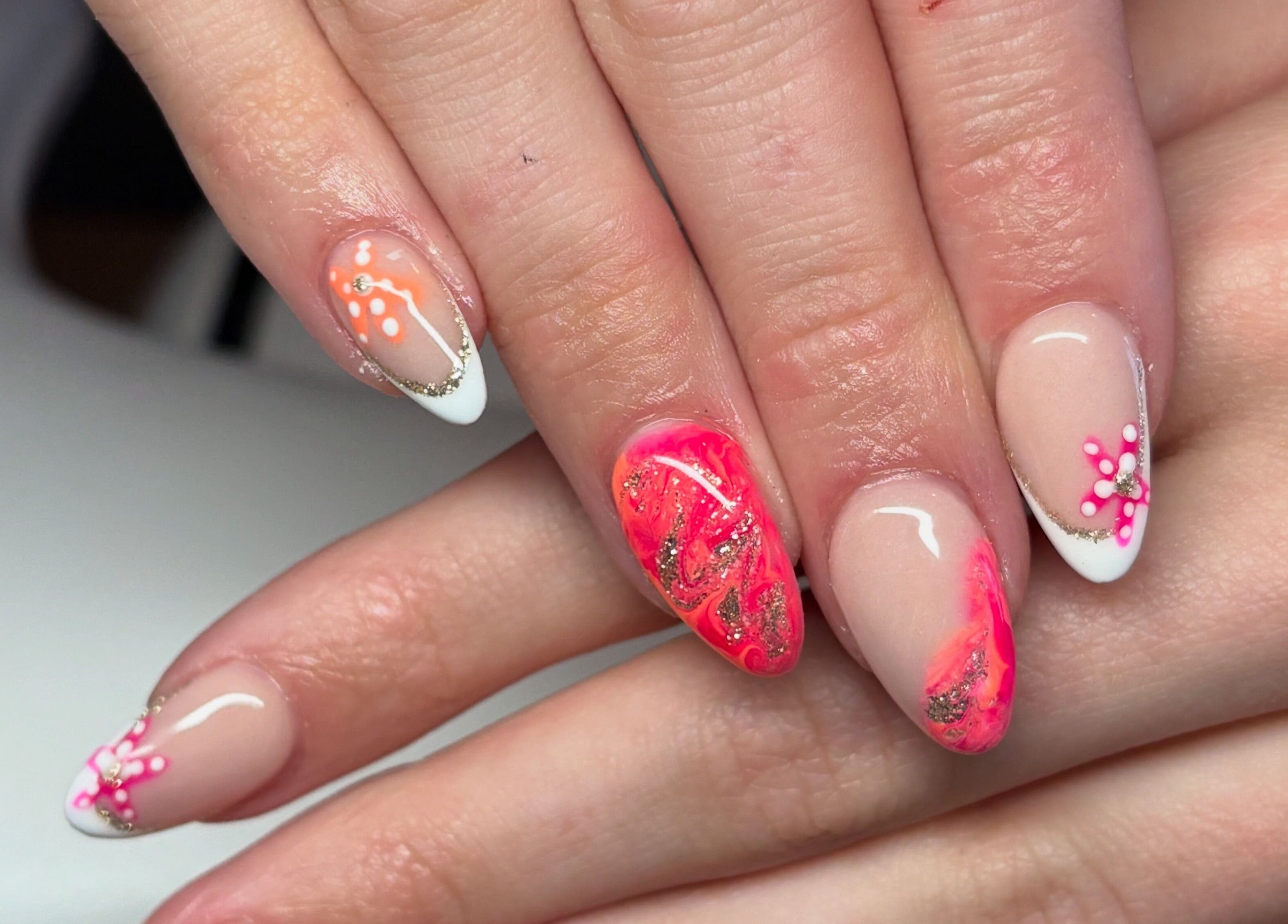 Stylish nail art with pink and orange details at The Boujee Nail Club, Bathgate, Scotland, GB.