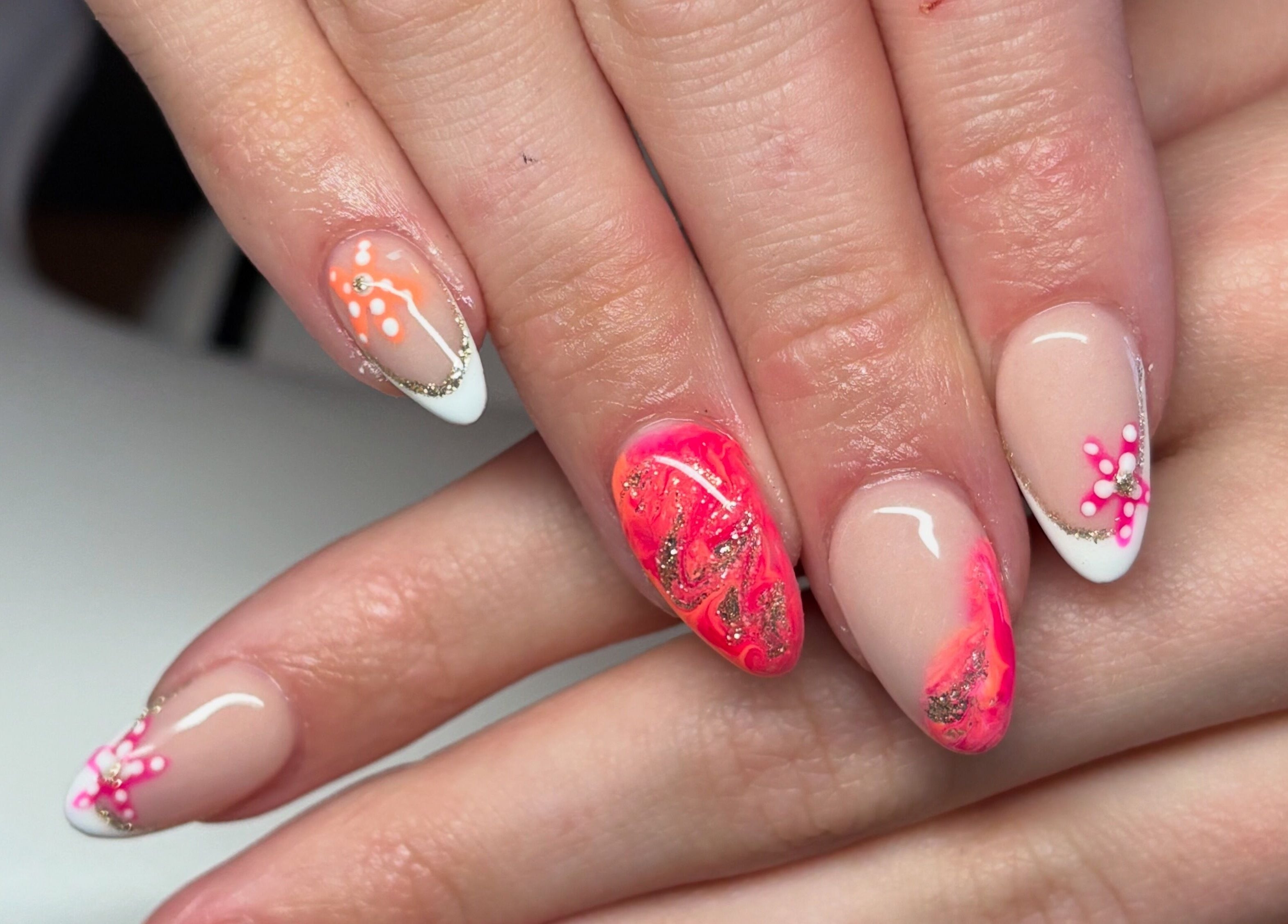 Stylish nail art with pink and orange details at The Boujee Nail Club, Bathgate, Scotland, GB.