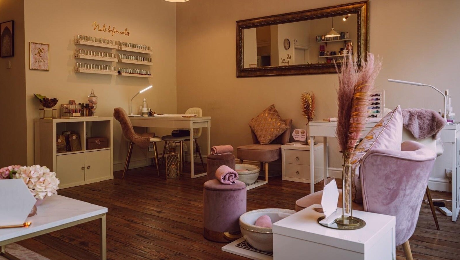 RJ Beauty's serene nail studio in Halifax, England, GB, featuring chic decor and plush seating for relaxation.