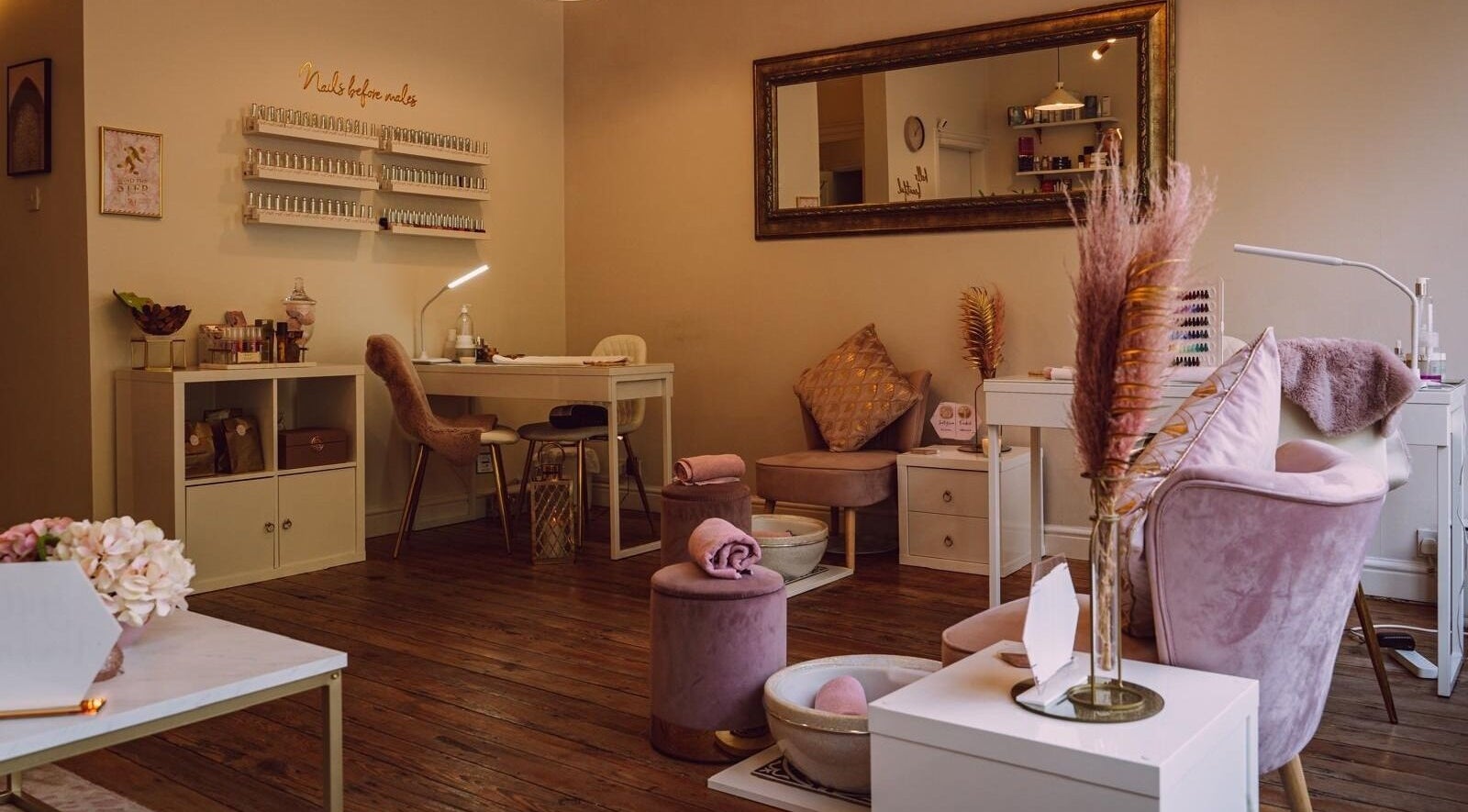 RJ Beauty's serene nail studio in Halifax, England, GB, featuring chic decor and plush seating for relaxation.