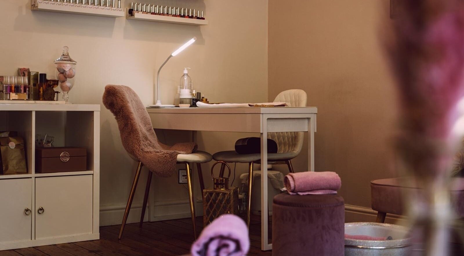 Manicure station with plush chairs at RJ Beauty, Halifax, England, GB; a relaxing beauty retreat.