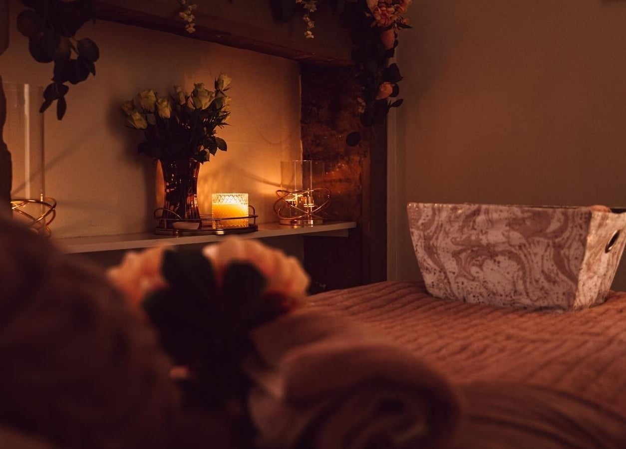 Relaxing spa room at RJ Beauty, Halifax, England, GB with warm lighting and elegant decor.