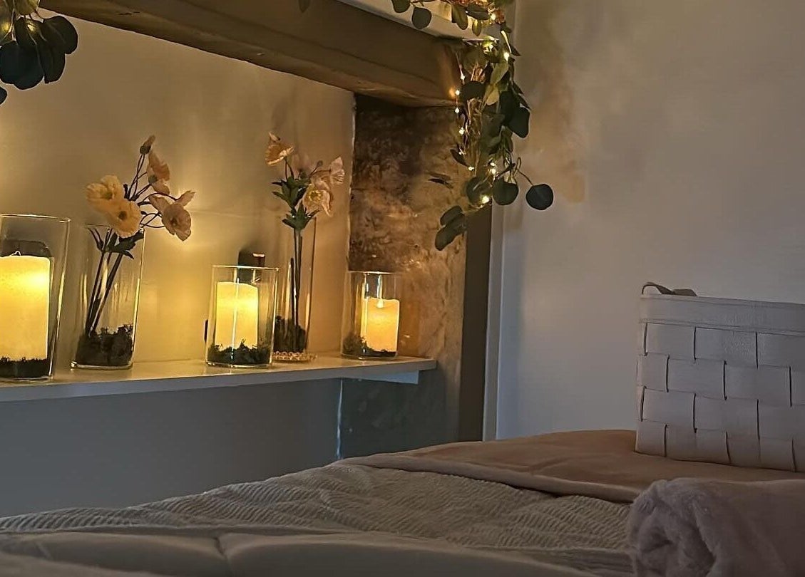 Tranquil candlelit room at RJ Beauty, Halifax, England, GB enhancing relaxation and serenity.