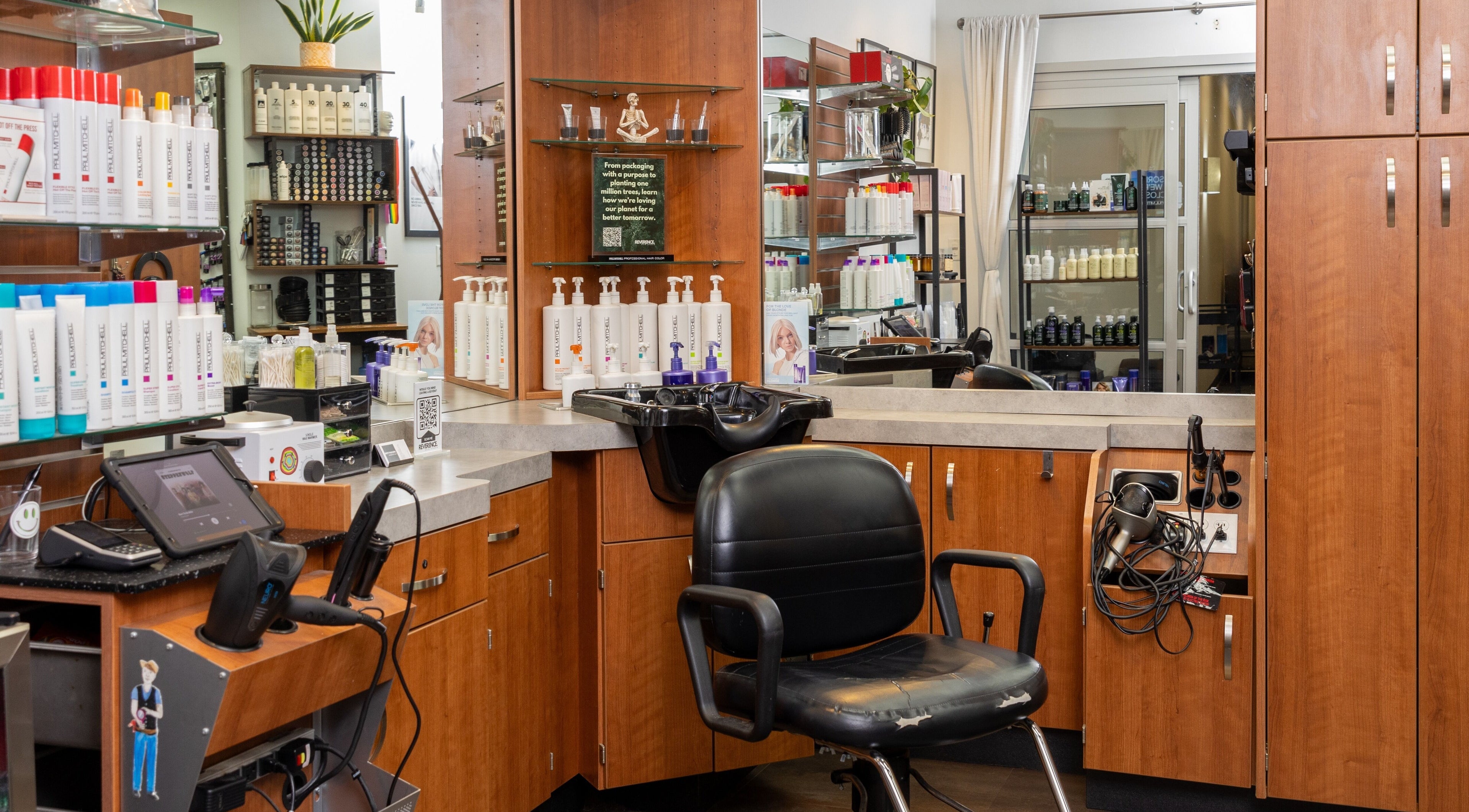 Reverence Hair Studio interior with styling chair in Knoxville, Tennessee, US. Bright, modern salon setup.