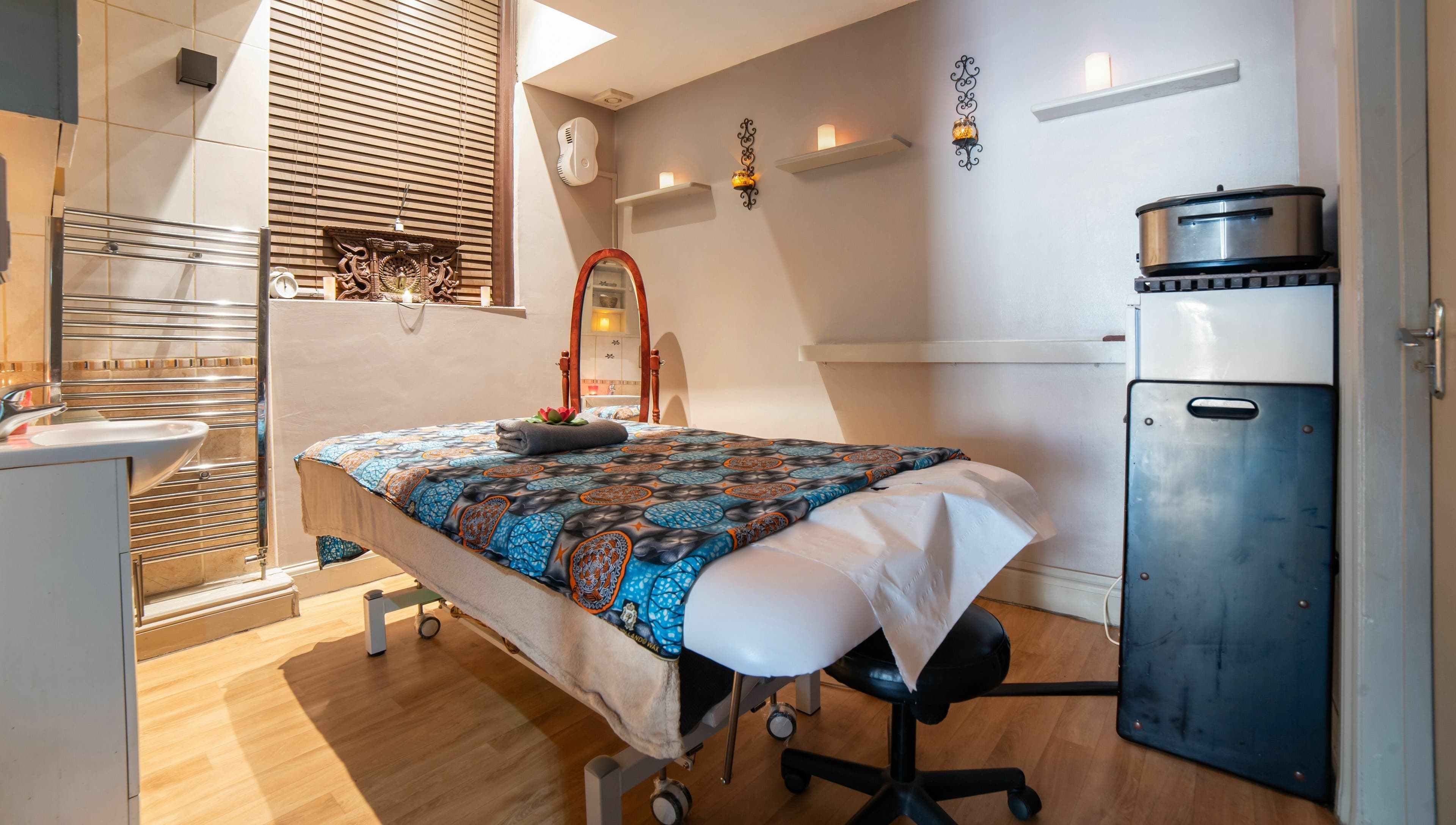 Tranquil massage room at Himalayan Springs Spa & Massage Centre, London, England, GB, featuring elegant decor.