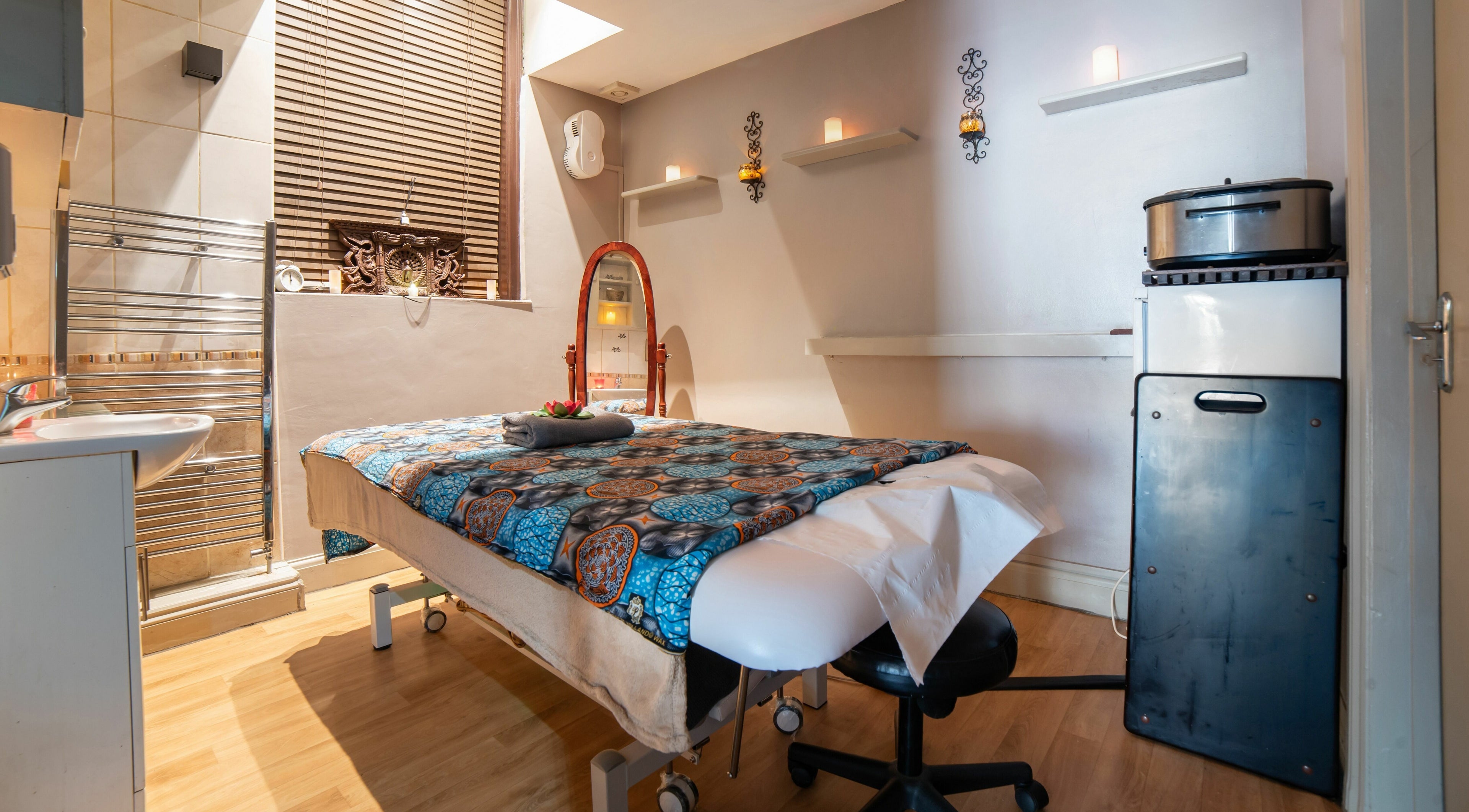 Tranquil massage room at Himalayan Springs Spa & Massage Centre, London, England, GB, featuring elegant decor.