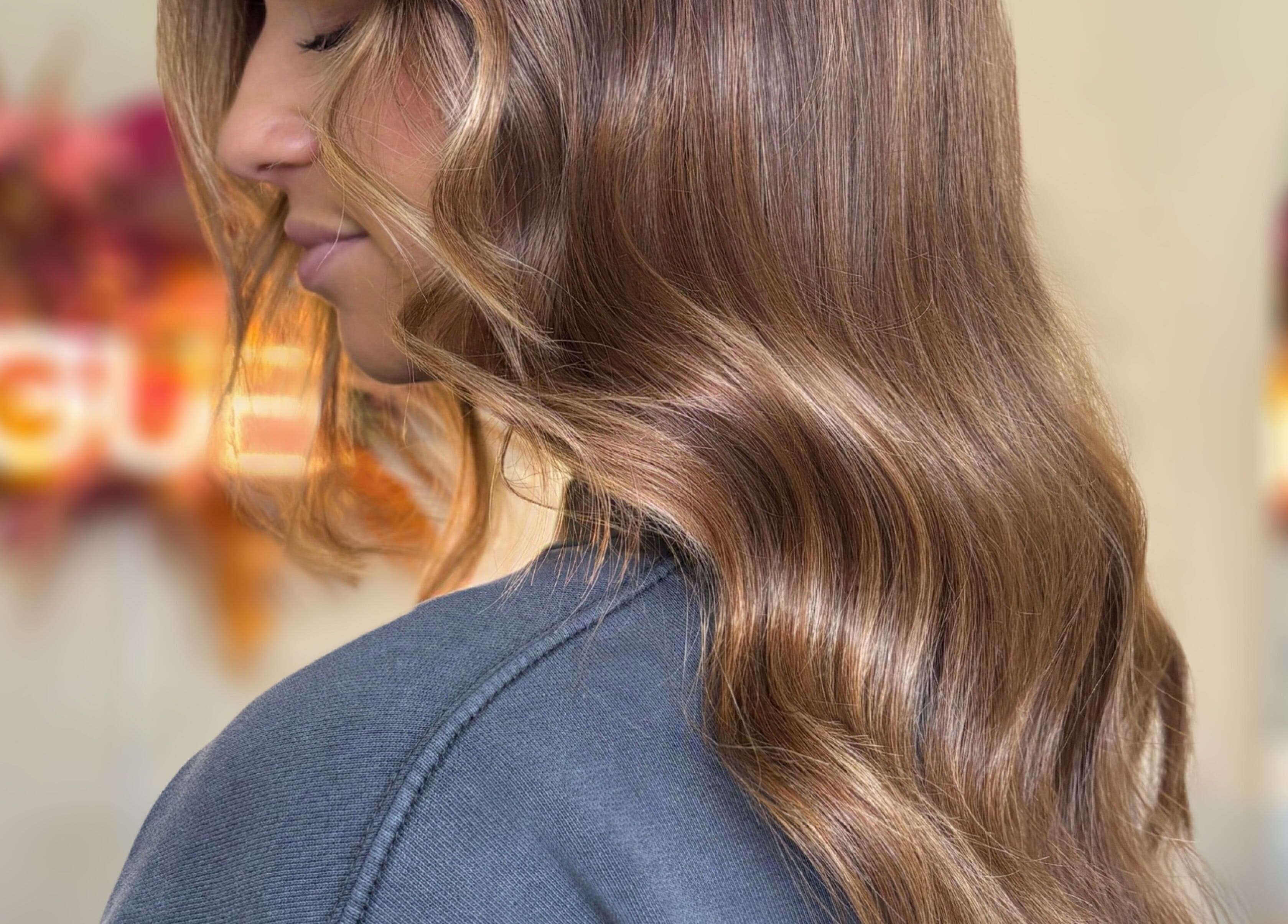 Elegant wavy brown hairstyle at Rogue & Vow, Blidworth, England, GB.