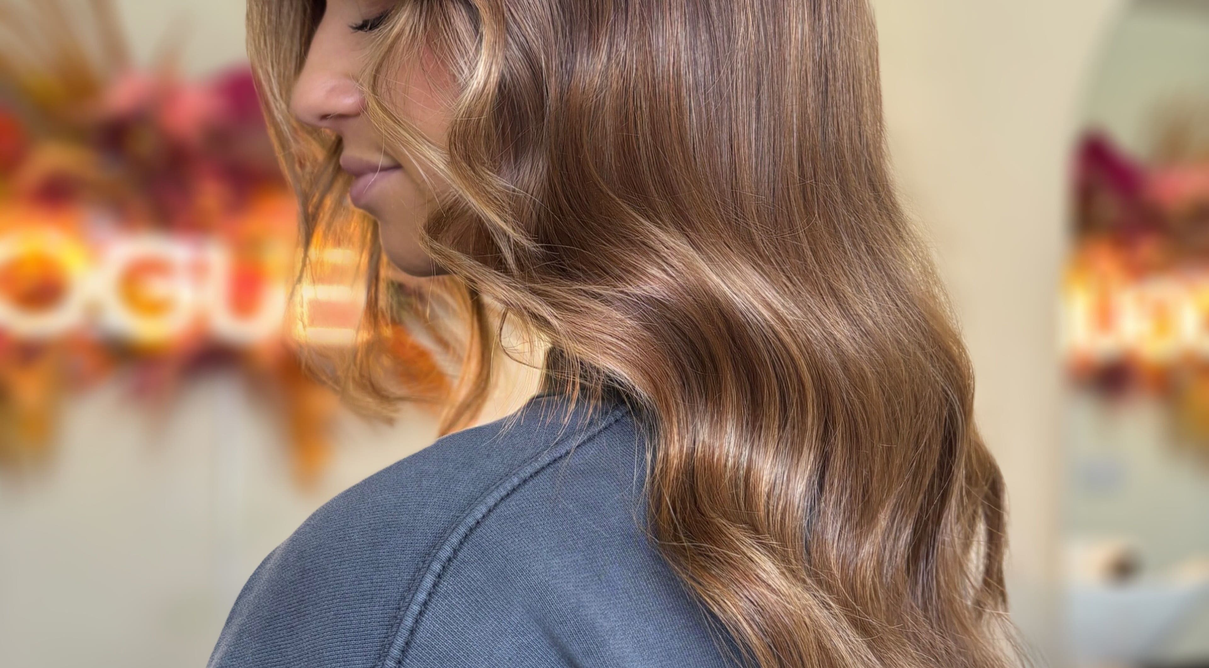 Elegant wavy brown hairstyle at Rogue & Vow, Blidworth, England, GB.