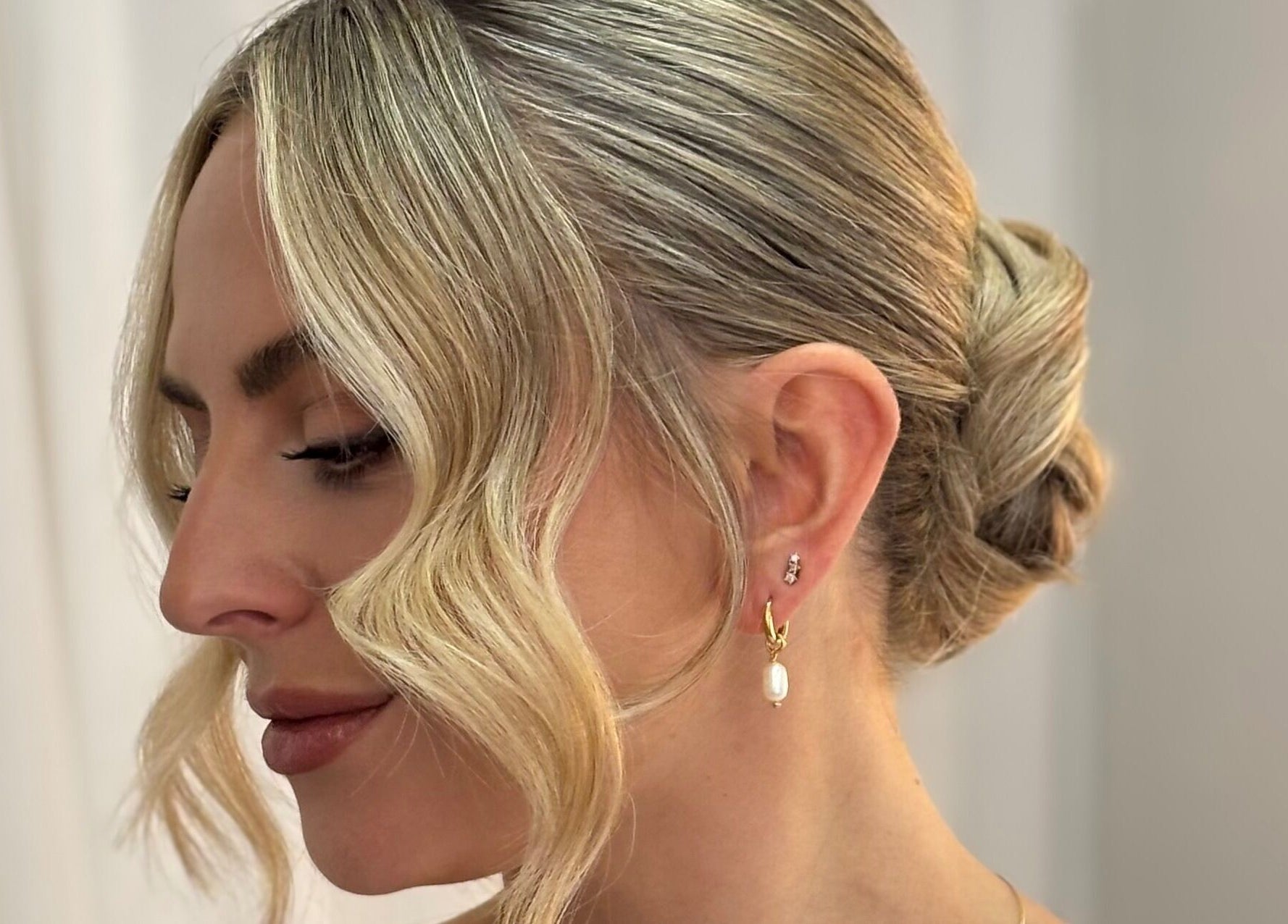 Chic blonde updo hairstyle at Rogue & Vow, Blidworth, England, GB.