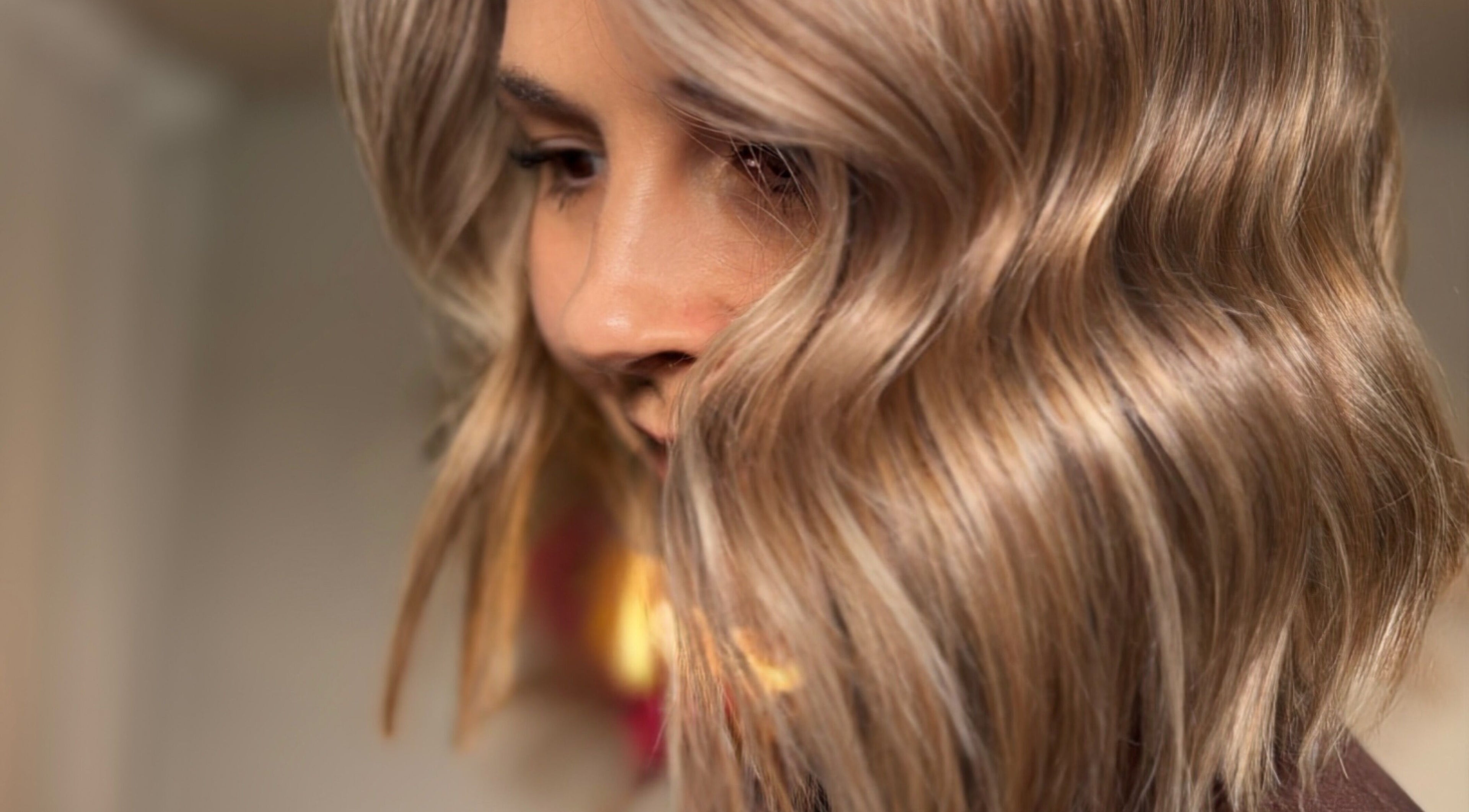 Close-up of styled golden waves at Rogue & Vow, Blidworth, England, GB salon.