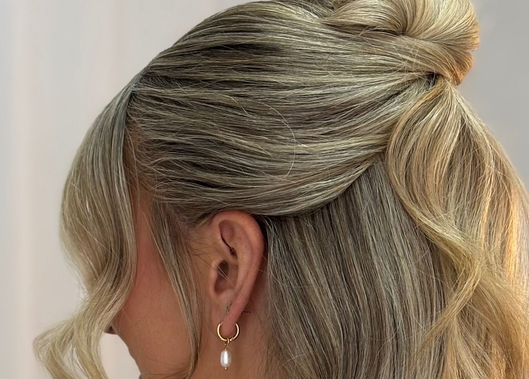 Stylish blonde updo at Rogue & Vow, Blidworth, England, GB highlights expert hairstyling.