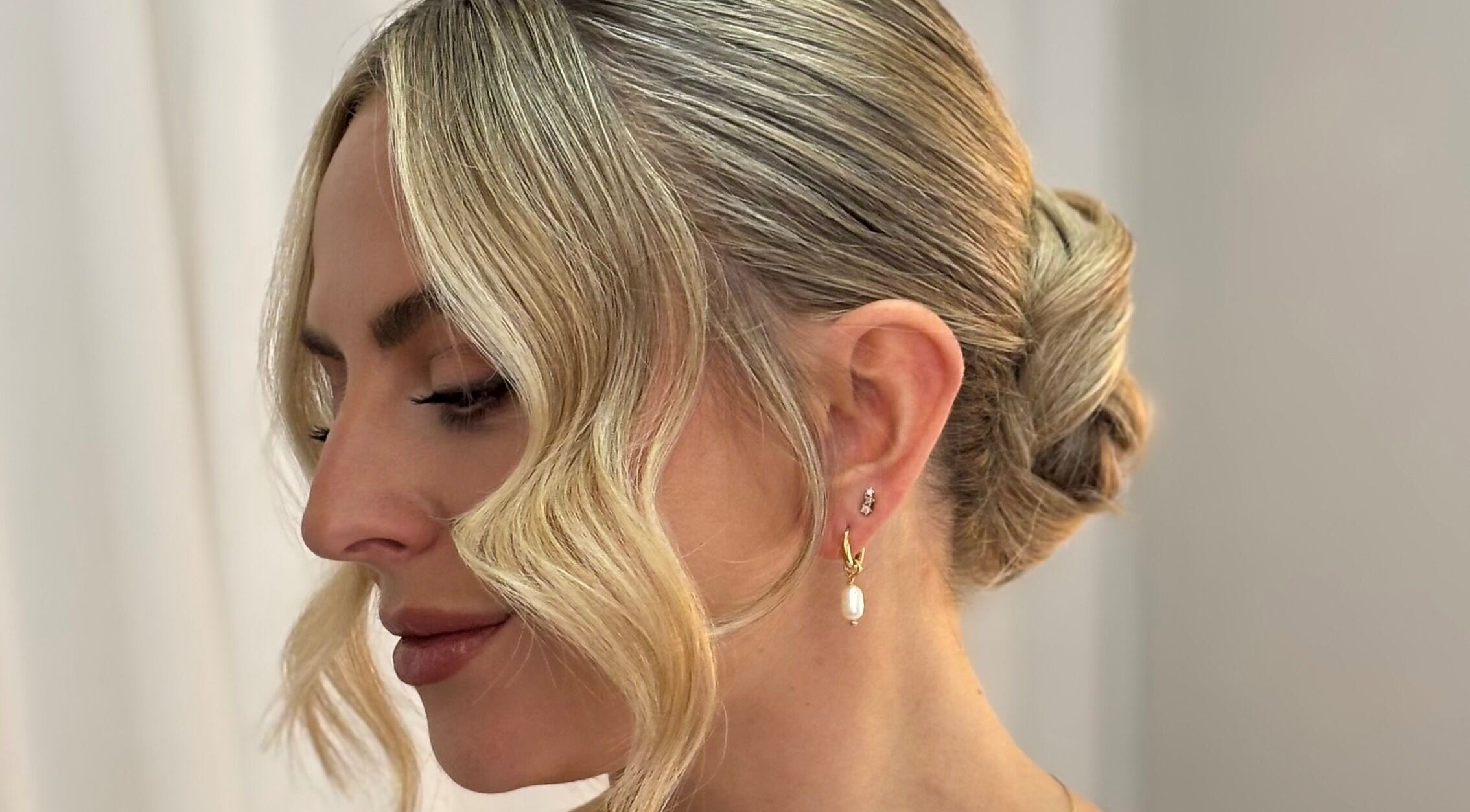 Elegant blonde updo hairstyle at Rogue & Vow, Blidworth, England, GB.