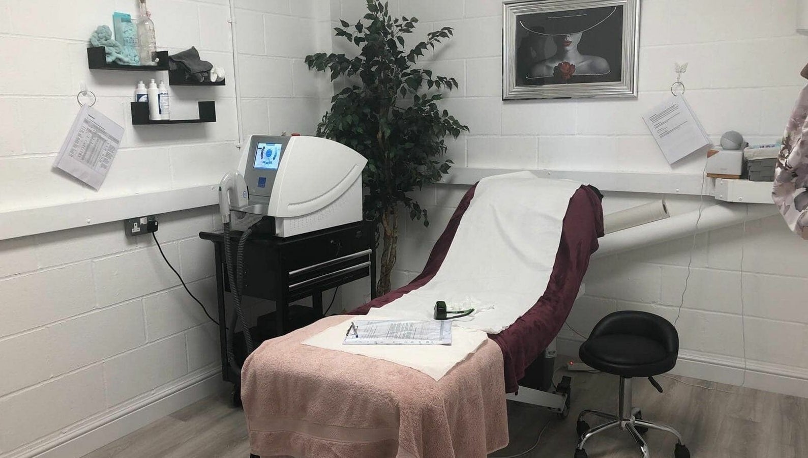 Hayley’s Hair Removal and Aesthetics serene therapy room in Poole, England, GB with modern equipment.