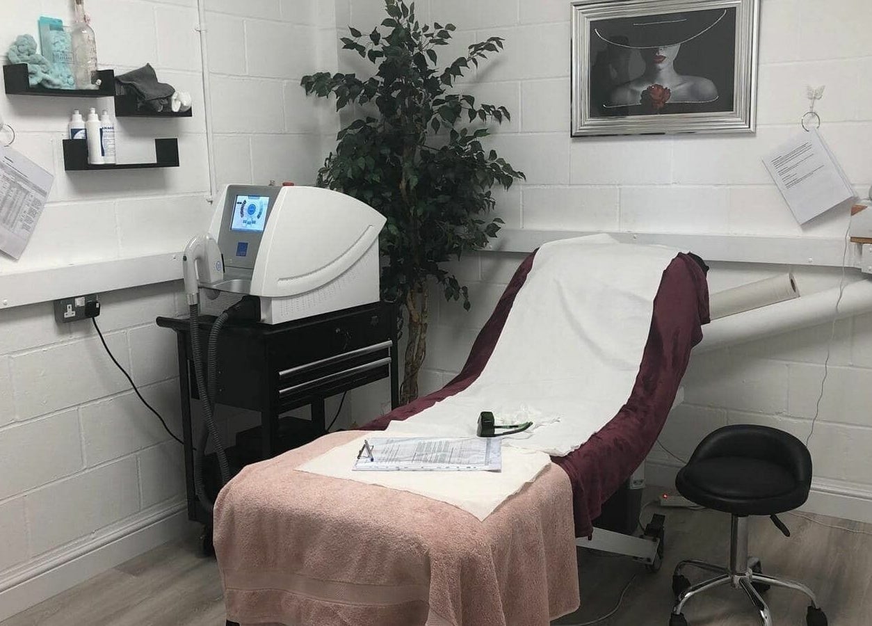 Hayley’s Hair Removal and Aesthetics serene therapy room in Poole, England, GB with modern equipment.