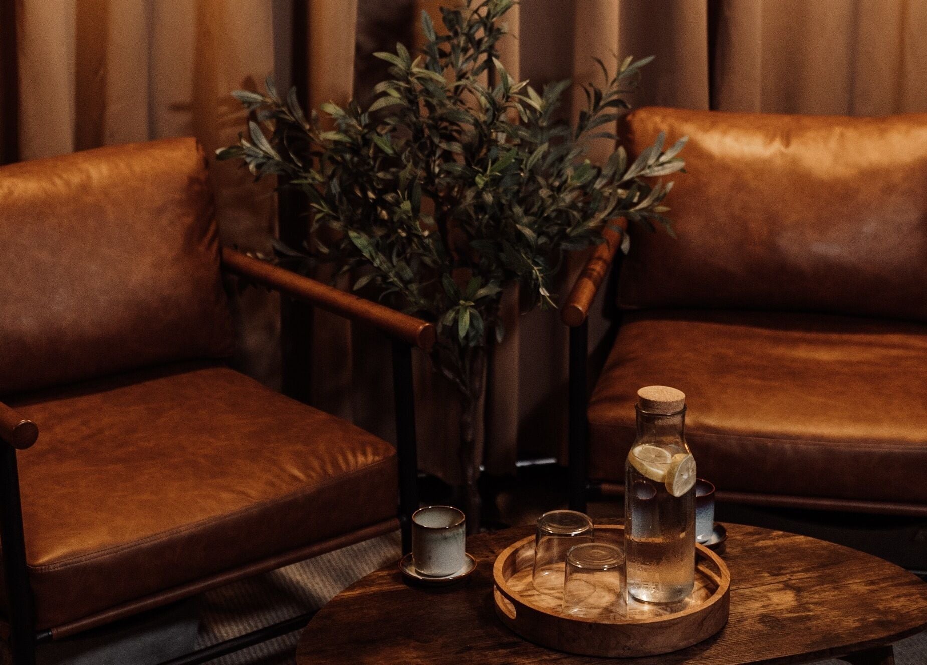 Relax in leather armchairs at House of Soul Feniscowles, Feniscowles, England, GB with a touch of greenery.